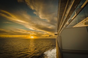 Sunset viewed from a cruise ship at sea, depicting an idyllic holiday protected by Travel Insurance